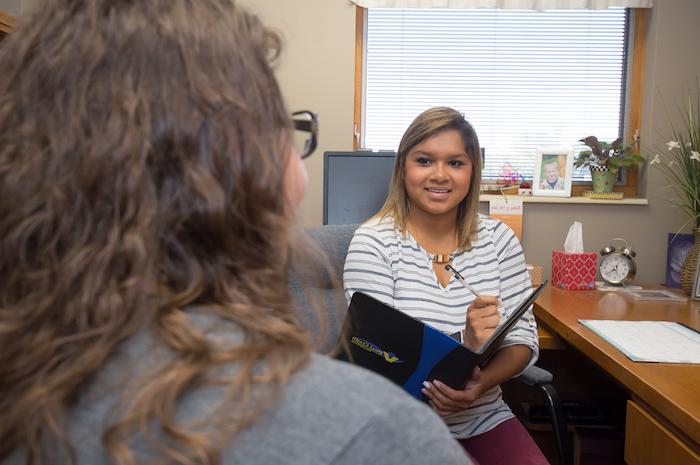 A hiring manager holding an interview in her office