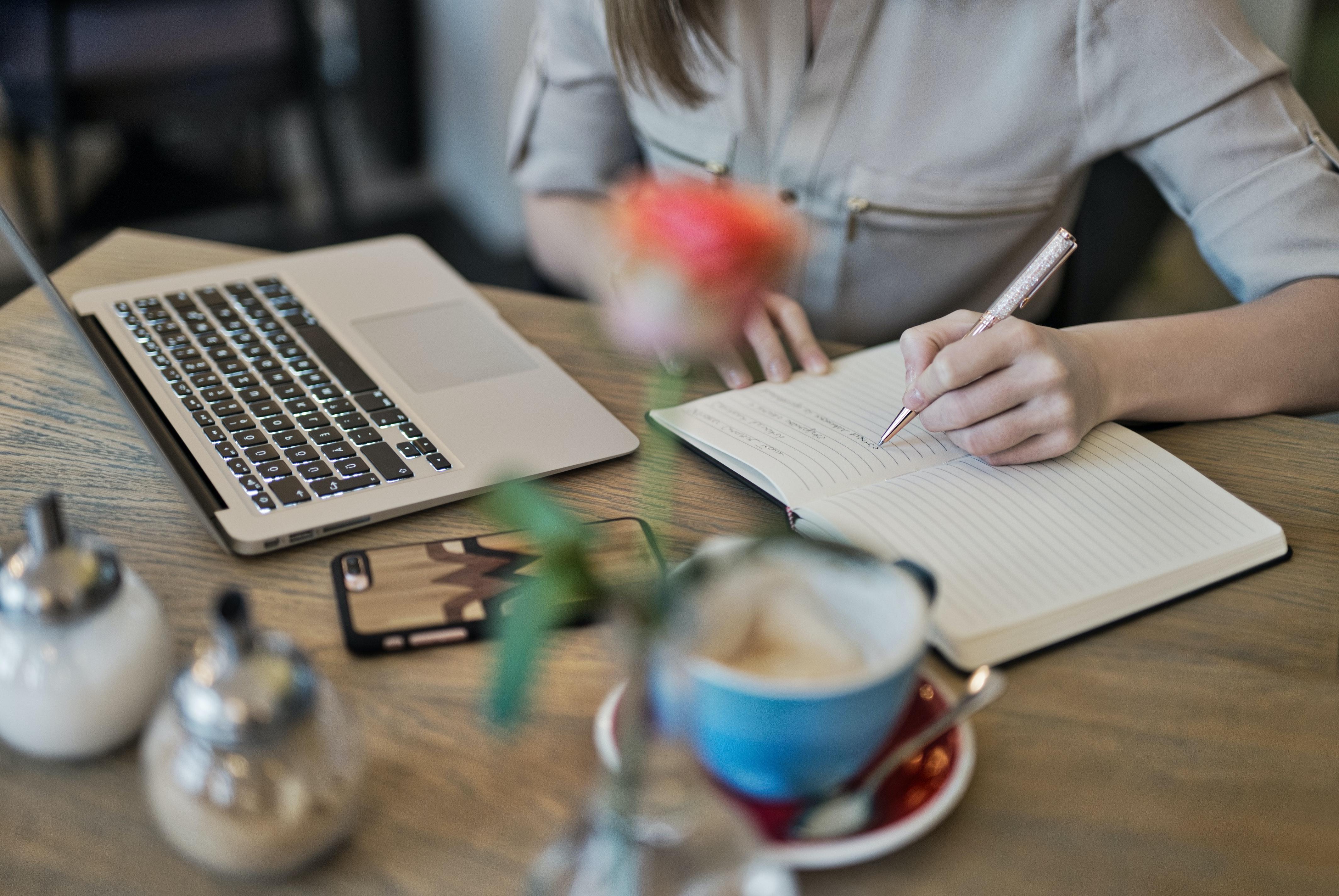 A woman doing homework at her desk